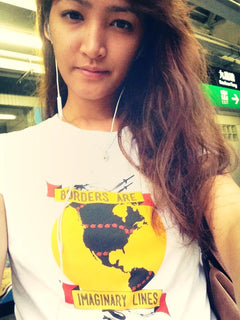 Person wearing the Borders Are Imaginary Lines t-shirt